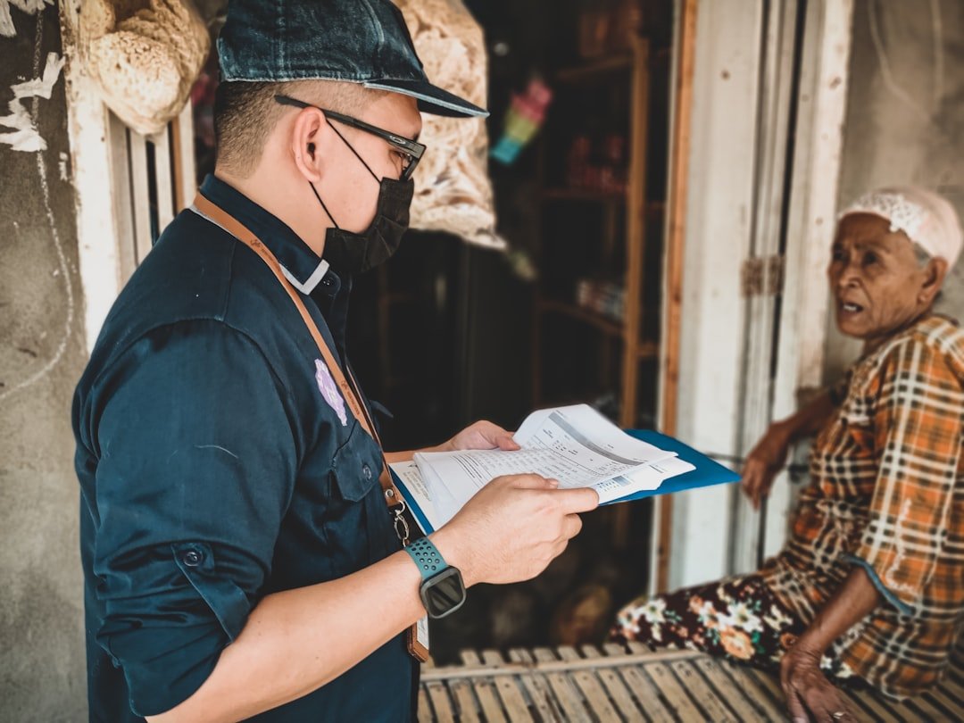 A commercial driver reviewing paperwork, relevant to Singapore's driving licence and vocational licence class distinctions for goods vehicle drivers