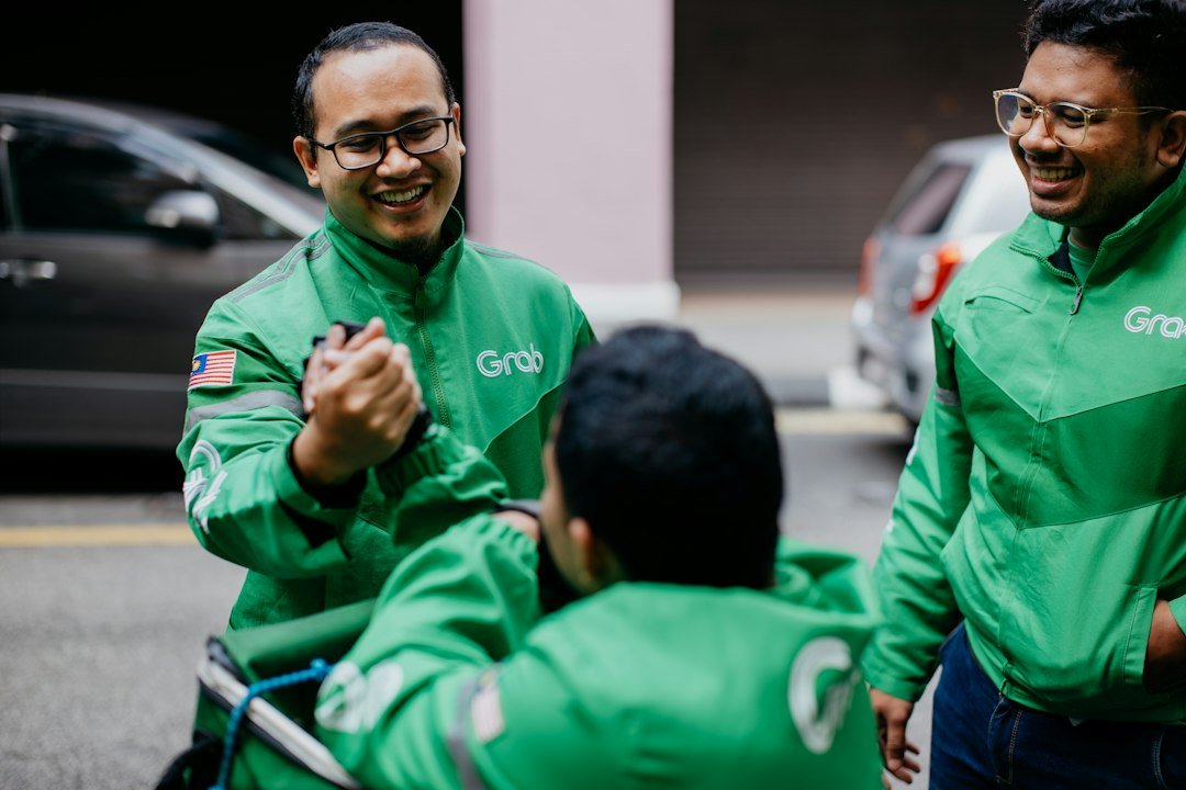 Delivery riders in Singapore, illustrating the Services sector classification that applies to most logistics and delivery employers for foreign worker levy purposes