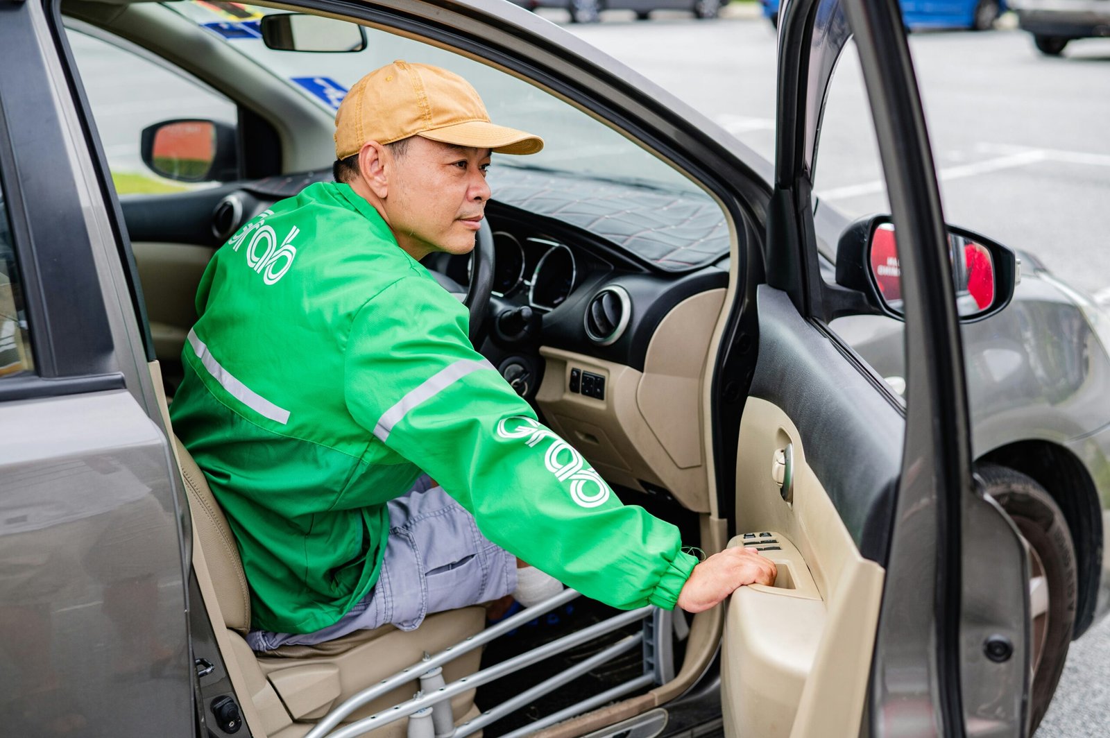 A Grab driver in an electric vehicle in Singapore, illustrating commercial EV operators eligible for Singapore's EV grant schemes