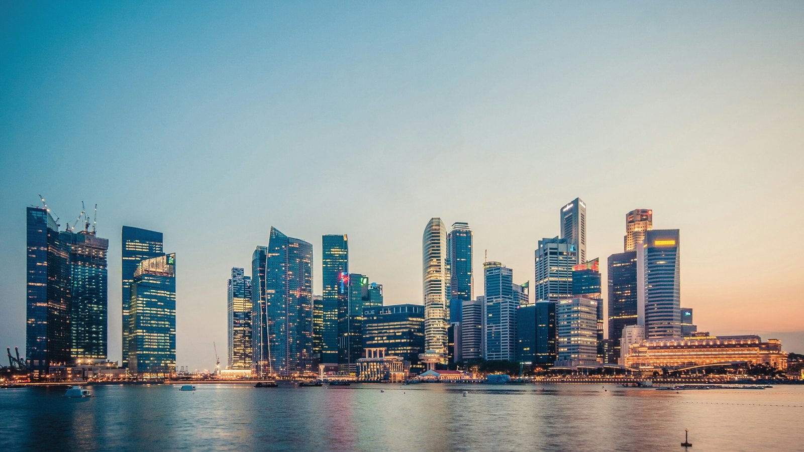Singapore's Marina Bay skyline at sunset, the backdrop against which fleet operators are weighing EV vs diesel total cost of ownership