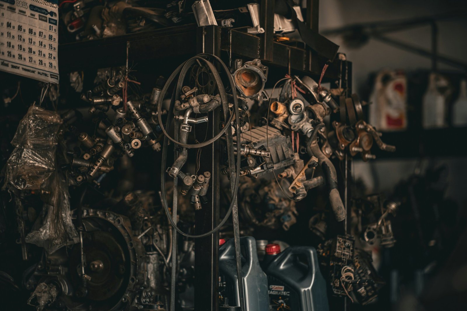 Mechanics repairing a commercial vehicle in a workshop bay, representative of typical repair jobs covered in this cost guide