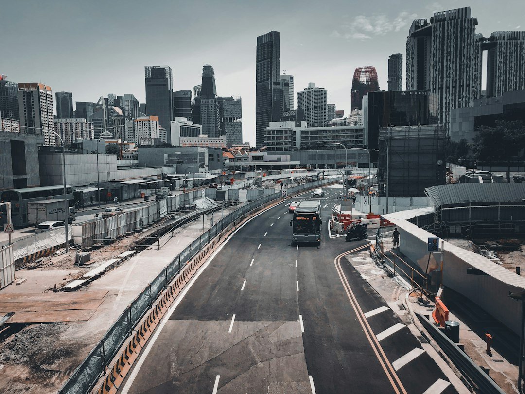 Traffic passing through Outram Park in Singapore, illustrating the goods vehicles and buses that fall under COE Category C