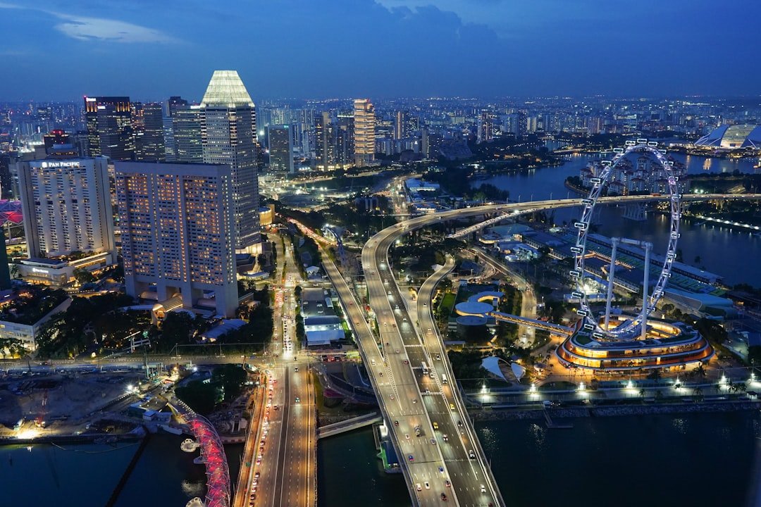 Illuminated Singapore expressway at night, illustrating night-shift driving conditions that raise commercial driver fatigue risk