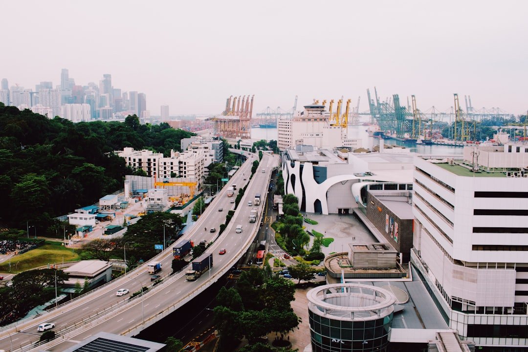 Traffic on a Singapore expressway with the city skyline in the background, relevant to licence class and permit requirements for modified commercial vehicles