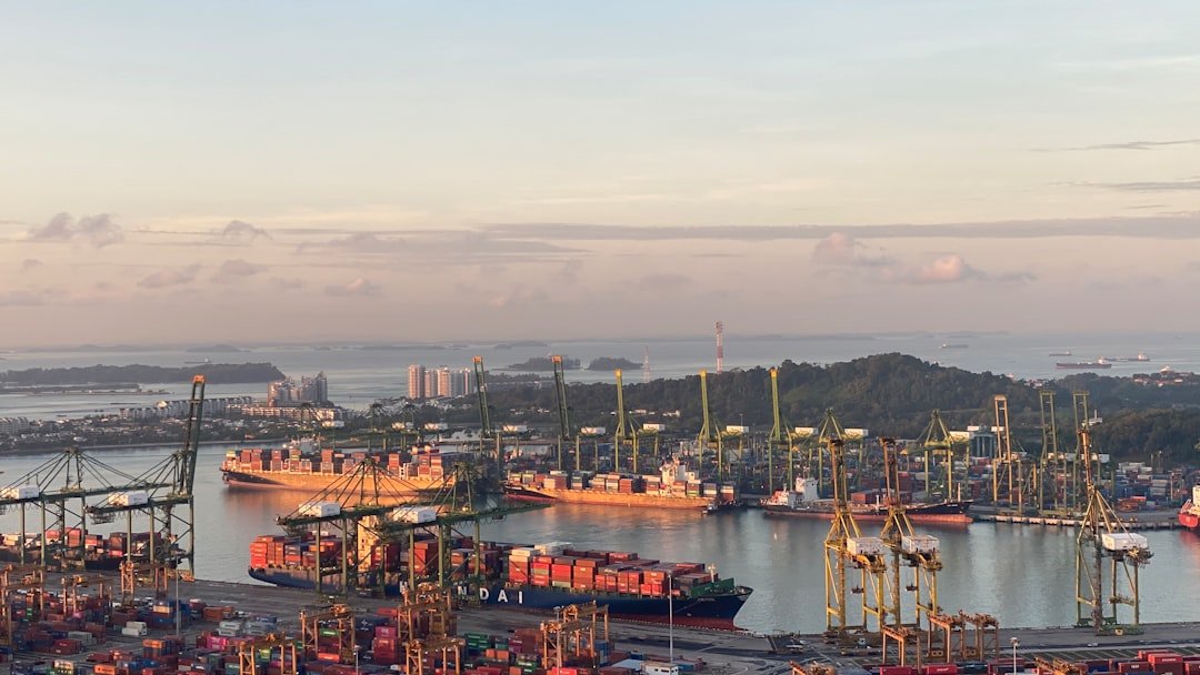 Morning view of Singapore's harbour, representing the shipping and customs clearance stage of importing a new commercial vehicle