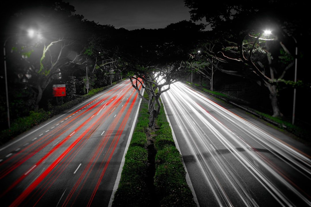 Light trails on a Singapore highway at night, illustrating rising road accident trends for commercial fleets in Singapore
