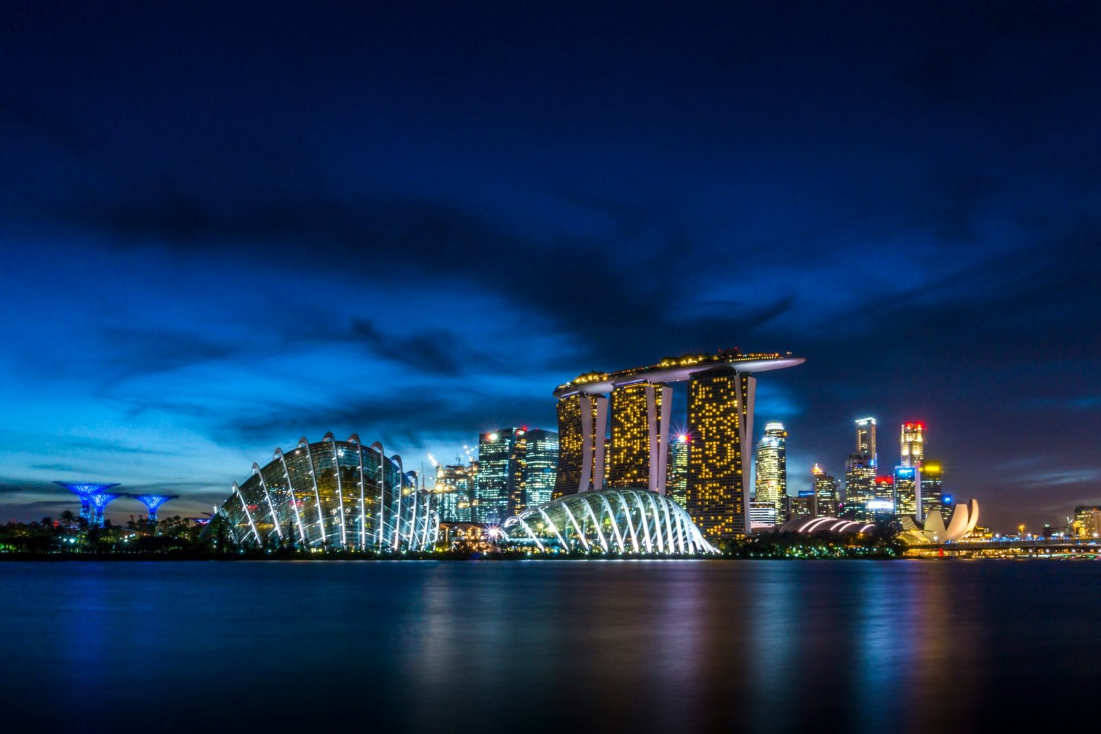 Singapore's city skyline at night, the setting for the nation's planned 2030 phase-out of internal combustion engine vehicles