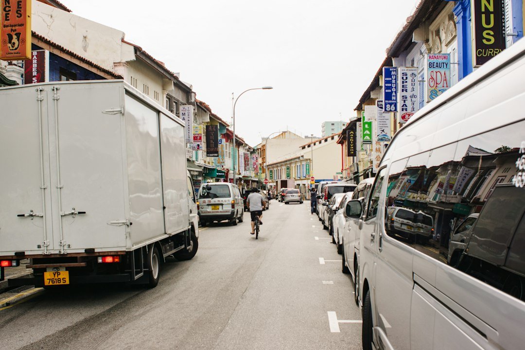 A street scene in Singapore, illustrating the road environment where LTA and Traffic Police enforce overloading and route restrictions on commercial vehicles